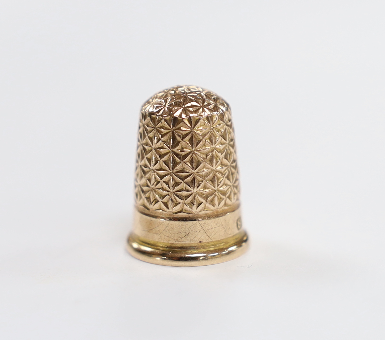 A George V 9ct gold thimble by Charles Horner, 23mm, 3.8 grams.